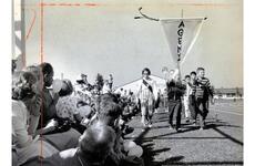 Tachikawa Air Base, Japan, Oct. 22, 1960: Standard of Athens leads Junior Olympic paraders at Tachi West Track at Tachikawa Air Base, Japan, Saturday, Oct. 22, 1960. Behind these athletes are competitors from teams named for Argos, Corinth, Thebes, Sparta and other ancient Greek cities.