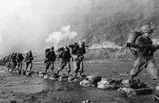 ROK troops cross a river during Operation Killing Zone.  