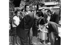 Rep. Daniel K. Inouye (D-Hawaii) greets one of the 400-some relatives in his ancestral village of Yokoyama, Japan. The Hawaiian congressman met many of the 2,200 villagers of Yokoyama — some 400 of whom are named Inouye.
