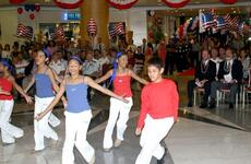 Members of local Guam dance troupe SKIP Entertainment perform during the opening ceremony of the Guam USO location in the Royal Orchid Hotel in Tumon, Guam.