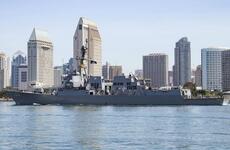 A sailor returns to the guided-missile destroyer USS Kidd at Naval Base San Diego after completing a coronavirus quarantine, June 5, 2020.