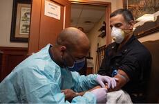 U.S. Navy Capt. Carlos Sardiello, commanding officer of the aircraft carrier USS Theodore Roosevelt (CVN 71), gives blood for a serology study aimed at identifying antibodies associated with COVID-19 aboard the ship on April 22, 2020.