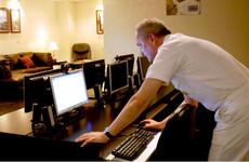 Kitty Hawk Strike Group Command Master Chief Terry Etherton checks his e-mail Friday at Yokosuka&#39;s new USO. The 2,000-square-foot center has free Wi-Fi and computers for active-duty military and their families.