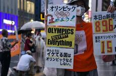 Anti-Olympics protestors hold a demonstration in central Tokyo, Thursday, July 8, 2021, the same day Japan's prime minister announced a fourth coronavirus state of emergency for the capital.