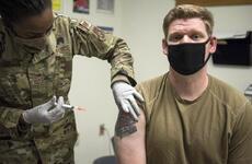 A service member receives the Moderna COVID-19 vaccine late last year at Kunsan Air Base, South Korea. Off base, 32% of the country’s 51 million residents have received the first dose of a vaccine as of Wednesday, July 21, 2021.