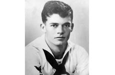 A black-and-white, World War II-era portrait of a Navy sailor in uniform.