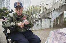 A Marine Corps veteran sitting in a wheelchair speaks about his wartime experiences. 