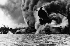 The USS Arizona burns after being struck by Japanese bombs 