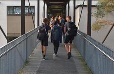 Students going to class on a walkway.
