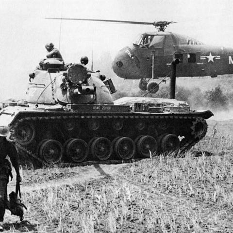 A MAG-16 helicopter and Marine M-48 tank
