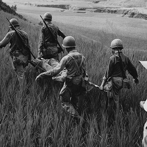 Marine Stretcher Bearers carry a wounded Marine