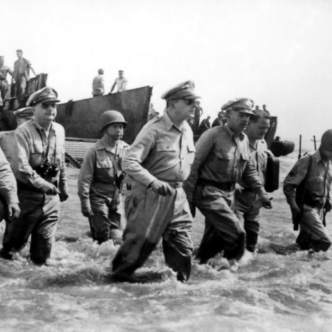 Douglas MacArthur with others wades ashore during the Battle of Leyte