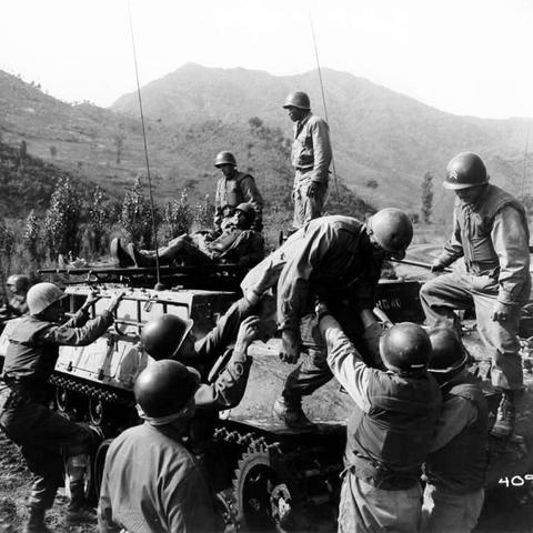 Korean War Medical corpsmen help wounded infantrymen