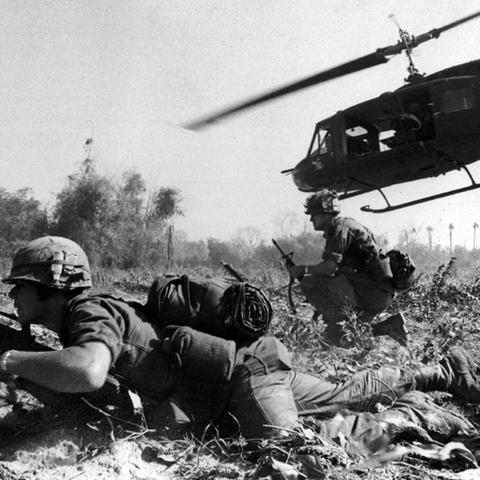 A UH-1D helicopter departs after unloading men