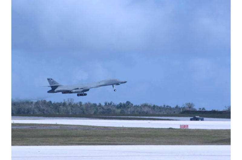 A B-1B Lancer bomber takes off from the runway at Andersen Air Force Base, Guam.