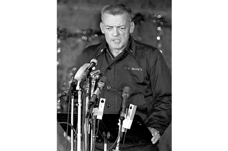 Cmdr. Lloyd Bucher talks to the press.
