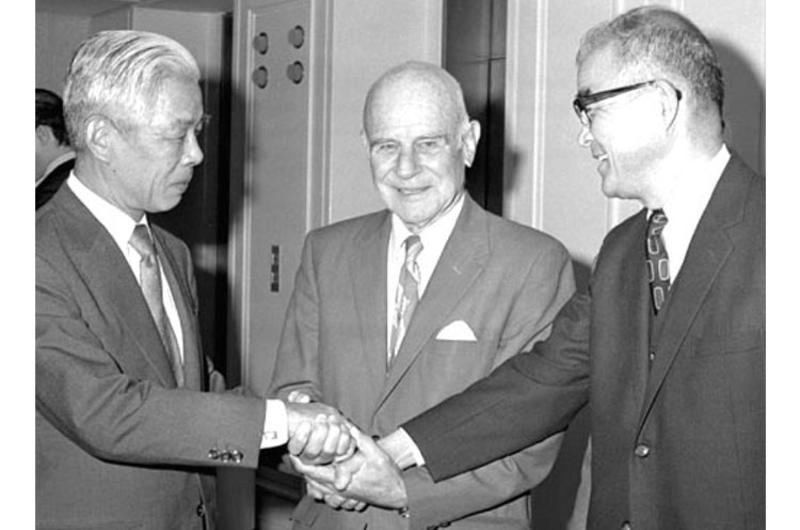 Retired Lt. Gen James H. "Jimmy" Doolittle, center, clasps hands with retired Japanese Rear Admirals Heijiro Abe, left, and Sadao Chigusa at the American Club in Tokyo in March, 1974.