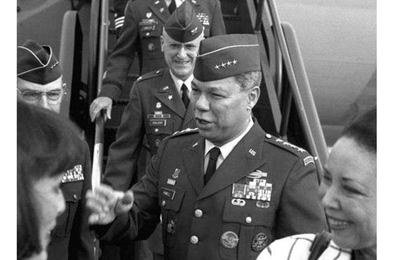 Gen. Colin Powell and his wife Alma, right, arrive at Yokota Air Base in Japan in November, 1991.