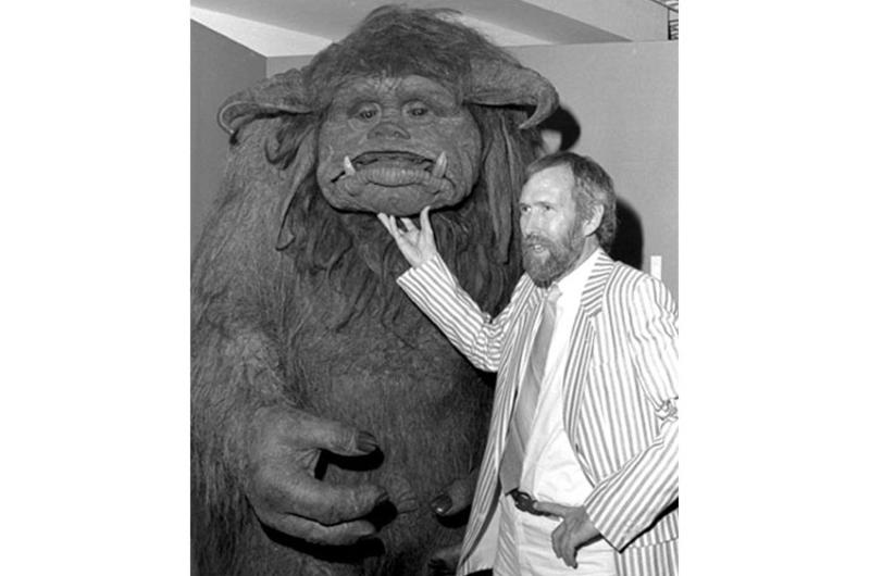 Jim Henson, creator of the Muppets, poses with the character Lado from at a Muppets exhibit at a Tokyo store.