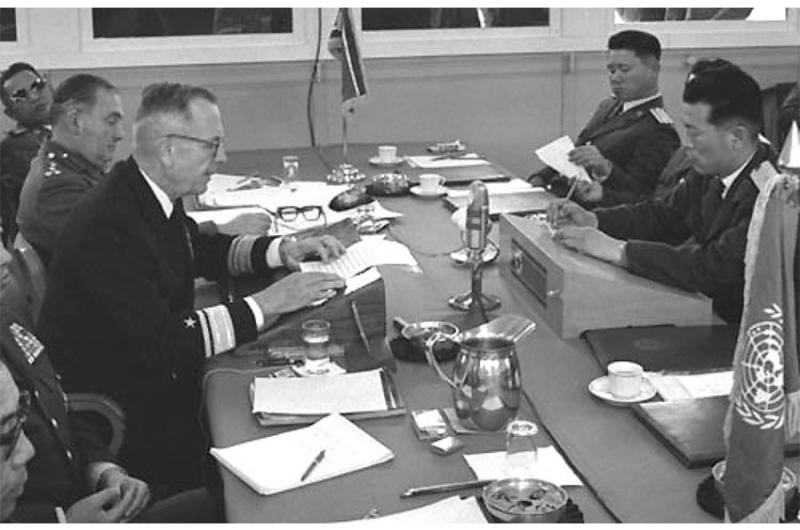 Rear Adm. John V. Smith reads a list of charges to North Korean Gen. Chung Kook Pak across the conference table at the 266 meeting of the Military Armistice Commission in April, 1968, days after four U.N. Command soldiers were killed in an ambush at the DMZ.