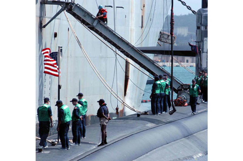 The second sub to arrive for Submarine Squadron 15, USS San Francisco, is moored along side its tender ship, USS Frank Cable, at Guam's Polaris Point.