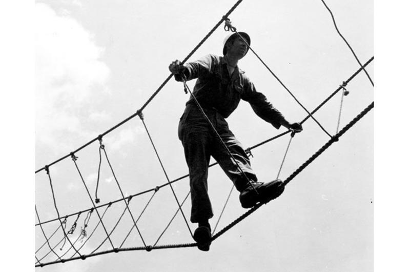 A bit wobbly but easy method of crossing ravines and rivers is this three rope bridge. An instructor shows the proper way of crossing. 