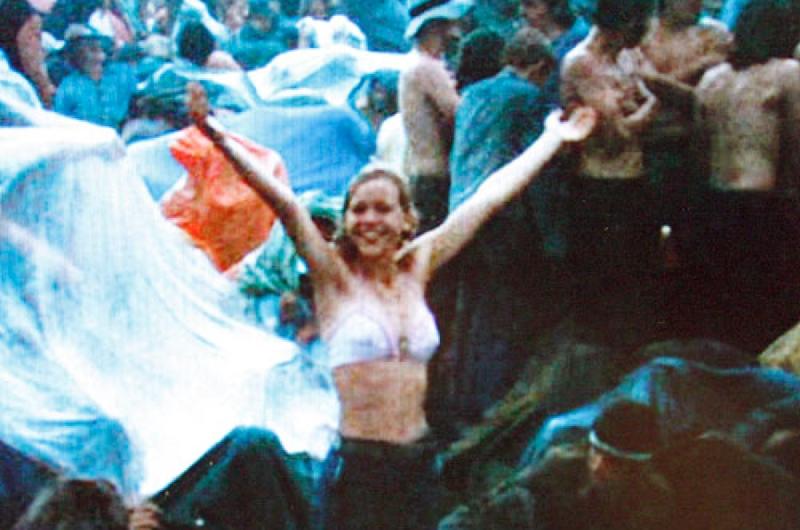 David Allen's 19-year-old sister, Kathy, frolics in the rain at Woodstock, catching the attention of the film crew.