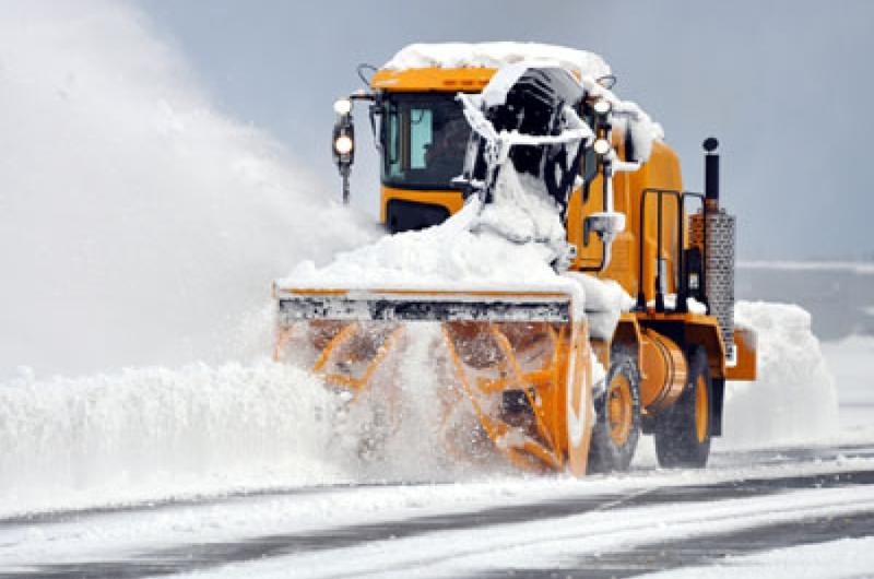 A worker with the 35th Civil Engineer Squadron’s heavy repair section plows the air field on Wednesday morning following 14 inches of overnight snow at Misawa Air Base, Japan.