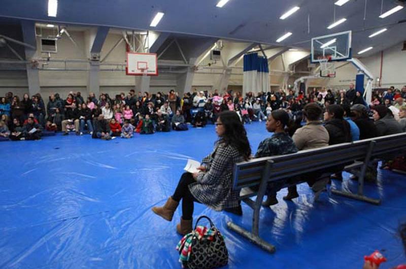 Large crowds gather Friday at Halsey Gym at Naval Air Facility Atsugi, Japan, to find out more information about the voluntary evacuation. Planes carrying family memebers are expected to start leaving Japan this weekend