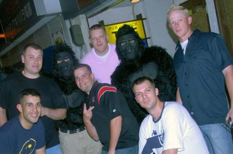 Airmen and sailors from Misawa Air Base, Japan, stop for a photo with two Monkeys Against Drunk Drivers volunteers on Aug. 8. Members of the 35th Maintenance Squadron’s Accessories Flight came up with the idea to give free rides after a recent spate of alcohol-related incidents.
