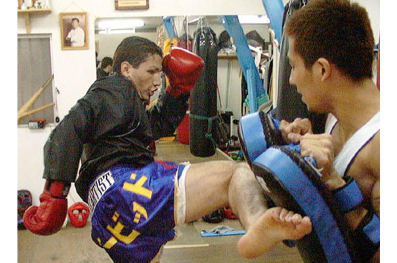 David Archuleta, left, mixes it up with sparring partner Masaaki Kato.