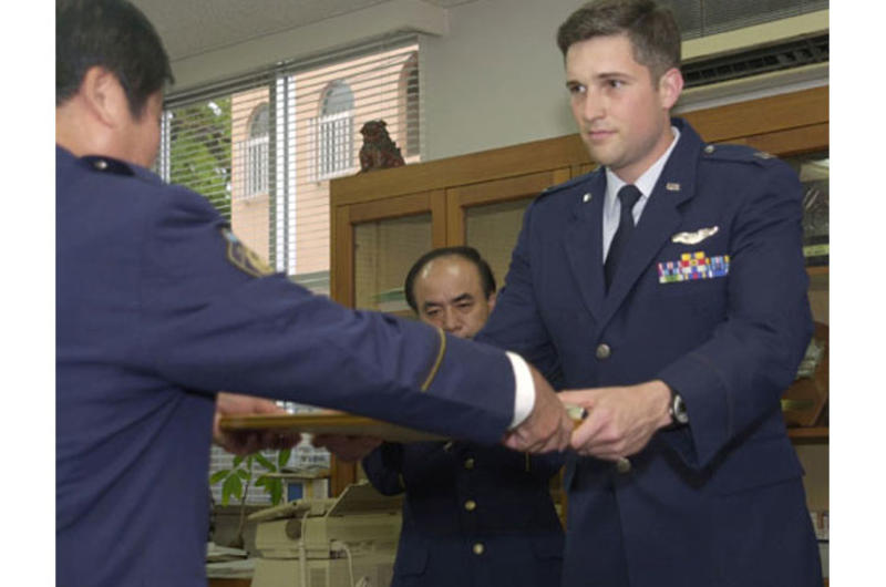 Capt. Thomas Geiser is commended by an Okinawa police station for saving an elderly man’s life April 3, 2003.