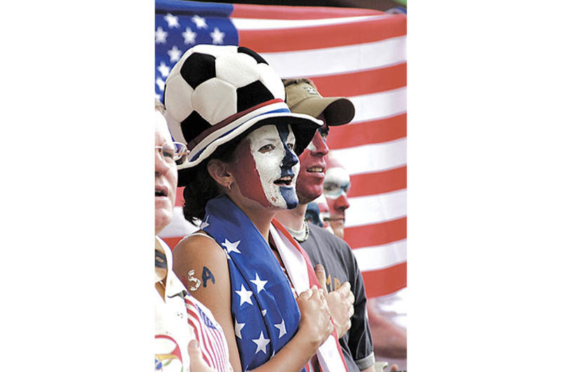 U.S. Army Capt. Misty Cornett sings the National Anthem at the start of the USA vs. South Korea World Cup game held in Taegu, South Korea.