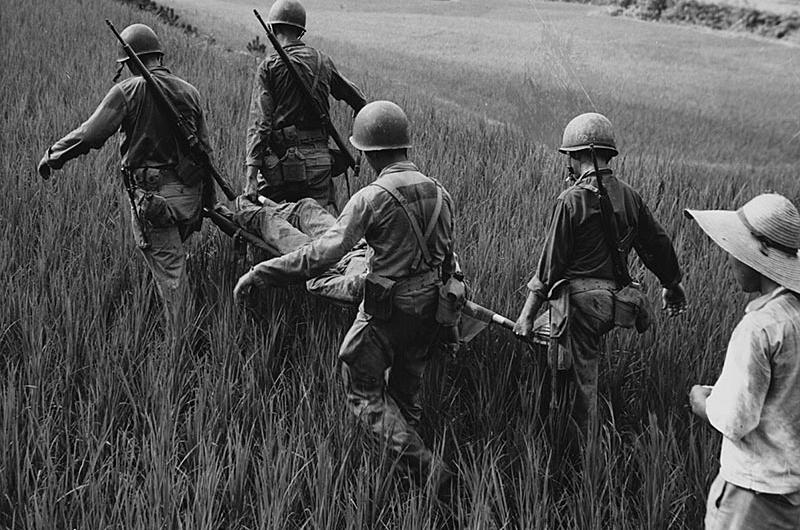 Marine Stretcher Bearers carry a wounded Marine