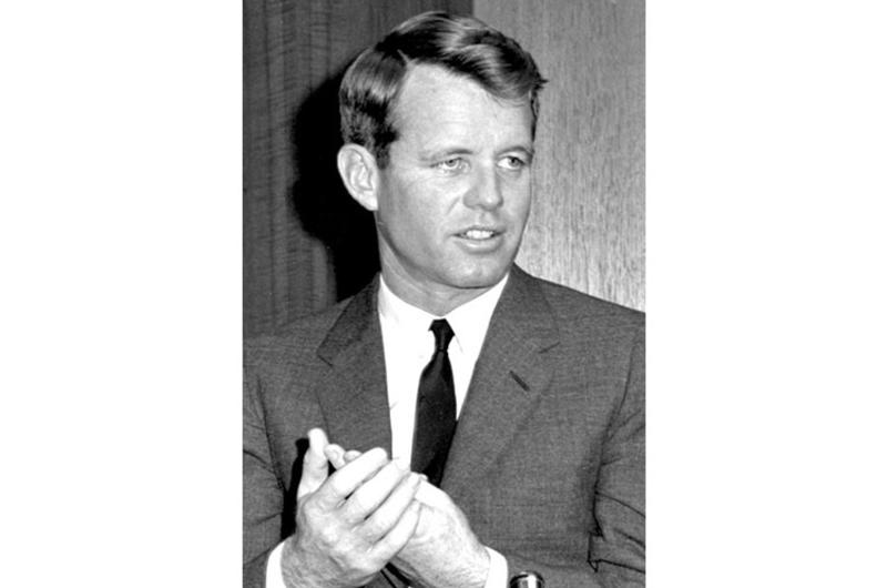 Tokyo, January 1964: Attorney General Robert Kennedy leaves the Imperial Hotel with Indonesian Foreign Minister Subandrio after his meeting with President Sukarno, then talks to the press at the Nissei Theater.