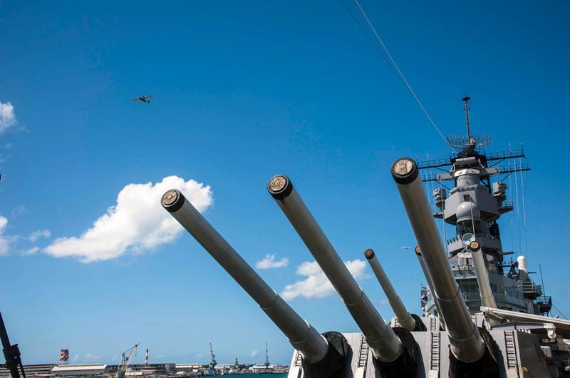A World War II-era warbird flies over the Battleship Missouri Memorial, moored in Pearl Harbor, Hawaii, during an aerial parade Aug. 30, 2020, as part of the 75th Anniversary of the End of WW II Commemoration.