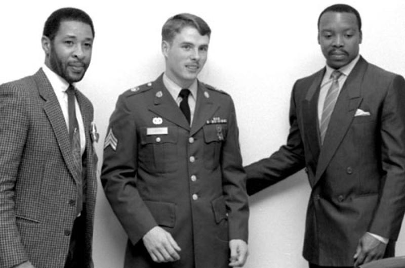 Cardinals players Ozzie Smith, left, and Vince Coleman, right, pose for a photo with Sgt. David Morse of Camp Zama in January, 1988.