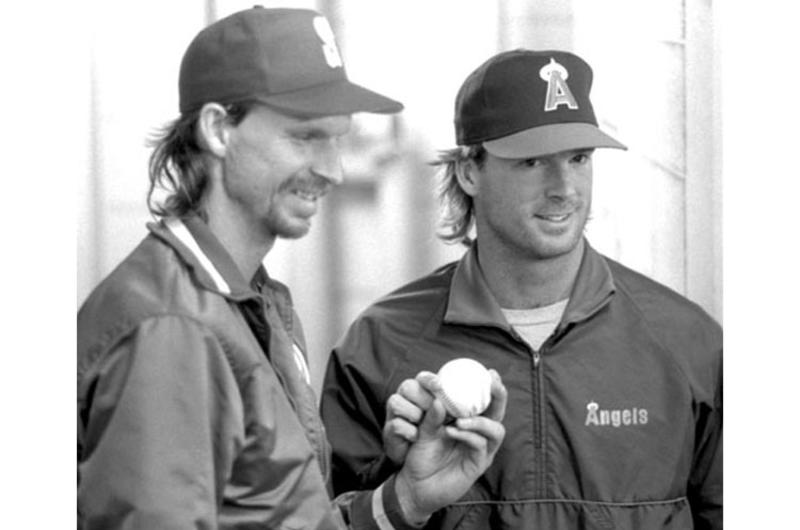 Randy Johnson and Chuck Finley pose for photos after the no-hitter against the Japan All-Stars.
