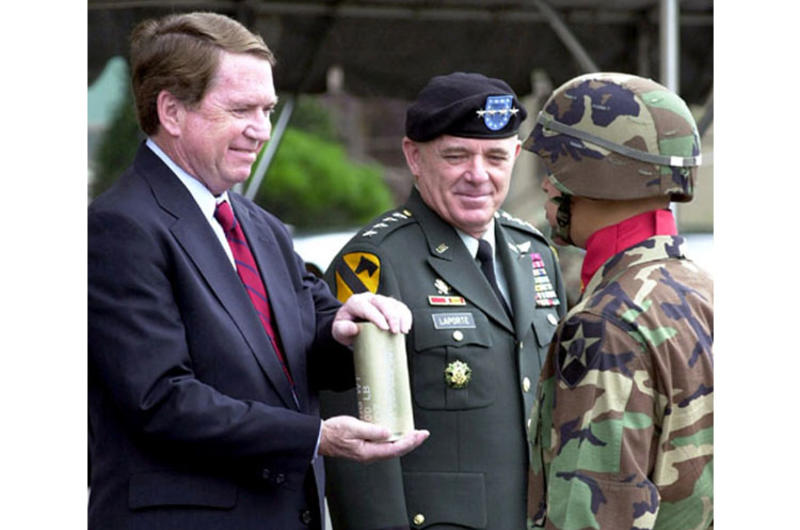 U.S. Ambassador Thomas C. Hubbard accepts an artillery shell from an honor guard soldier Tuesday at Yongsan Garrison. At center is U.S. Forces Korea commander Gen. Leon J. LaPorte.