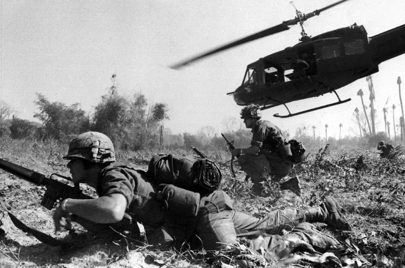 A UH-1D helicopter departs after unloading men