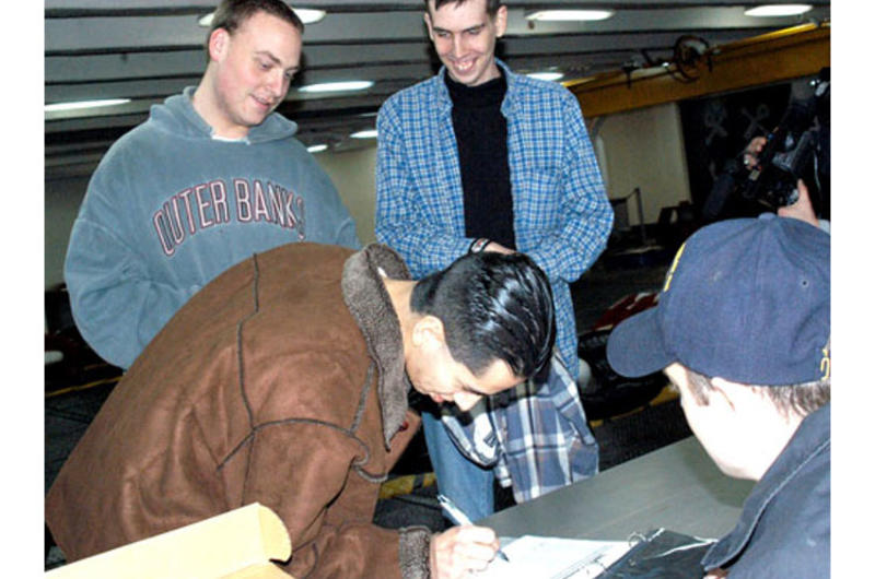 Seaman Gerson Rodriguez, 20, of California, signs out from the USS Kitty Hawk last week to enjoy liberty in Pusan, South Korea.