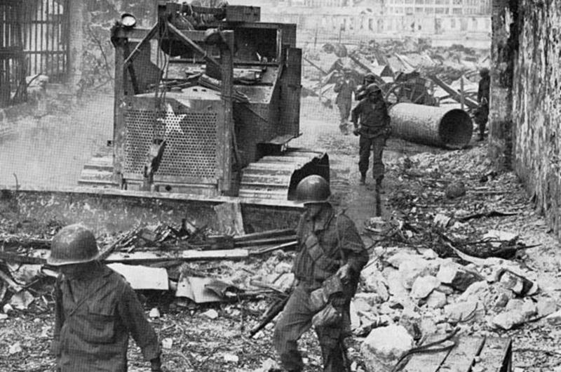 U.S. troops pictured in rubble of the Manilla.