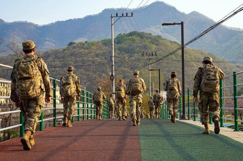 U.S. and South Korea troops take part in a ruck march at Camp Casey, South Korea, April 22, 2022.