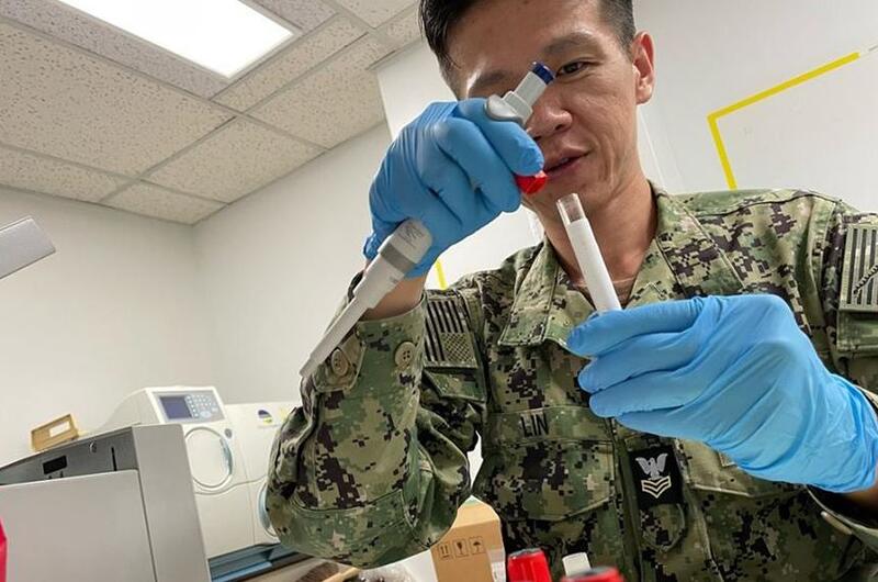 A hospital corpsman processes biological samples during a U.S. Naval Medical Research Unit Indo Pacific study on natural- and vaccine-derived immunity of respiratory diseases in U.S. sailors and Marines in September 2023.