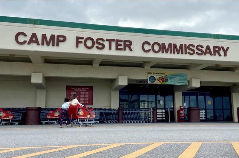 Children return an empty shopping cart outside the commissary at Camp Foster, Okinawa, Wednesday, Jan. 12, 2022. 