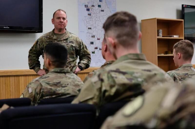Camp Humphreys garrison commander Col. Michael Tremblay briefs soldiers new to South Korea before they depart for Daegu, Tuesday, March 3, 2020.