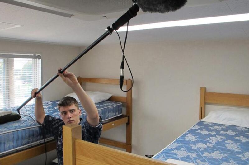 Seaman Greg House holds the boom mic during a May 2012 AFN shoot at Sasebo Naval Base, Japan.