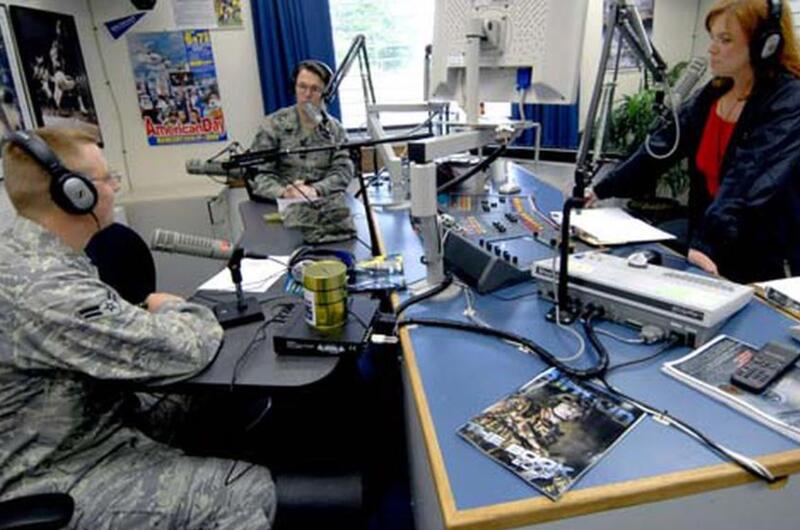 Airman 1st Class Donnie Lang, left, Tech. Sgt. Erick Tyndall, center, and American Forces Network radio deejay Jo Baker give computer advice to the Misawa Air Base, Japan, community during the Geek Squad program Friday morning.