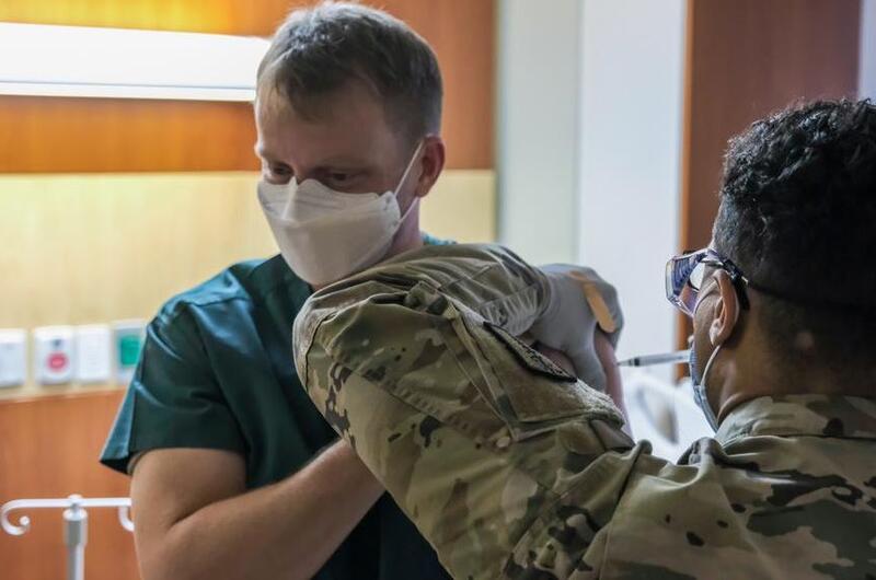 Lt. Col. Brian Cohee, an Army doctor, was the first U.S. service member to receive the Moderna COVID-19 vaccination in South Korea at Camp Humphreys, South Korea, Tuesday, Dec. 29, 2020.