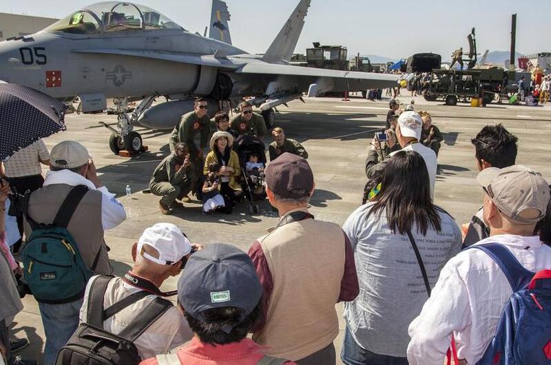 People attend the Friendship Day festival at Marine Corps Air Station Iwakuni, Japan, May 5, 2016.